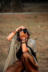 woman using DSLR camera thumbnail