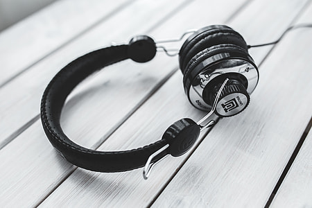 Black smartphone and headphones with various items thumbnail