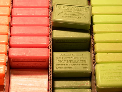 four lanes of assorted-color soap bar nicely stacked on brown cardboard box thumbnail