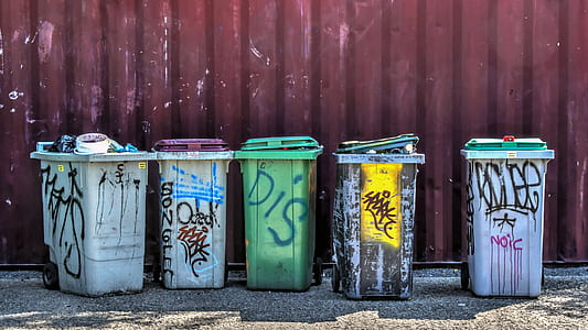 gray and green plastic trash bins thumbnail