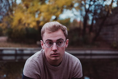 selective focus photography of man wearing eyeglasses thumbnail