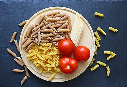 assorted pastas and tomatoes on tray thumbnail