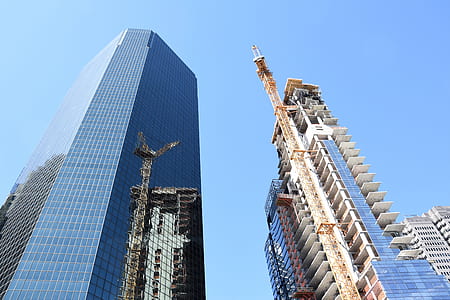 low-angle photo of blue glass building thumbnail