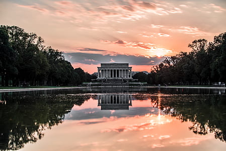 body of water near white building thumbnail