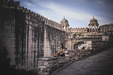 woman sitting on wall thumbnail
