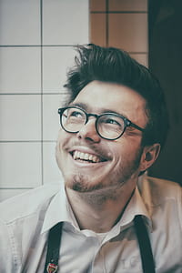 man wearing black framed eyeglasses and white collared shirt thumbnail