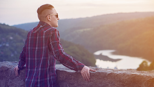 man near concrete wall during daytime thumbnail