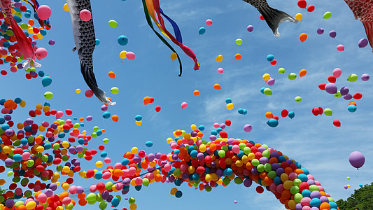time lapse photography of assorted-color balloon under calming sky thumbnail