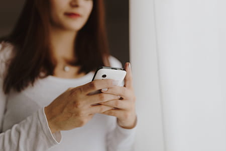 Beautiful young woman using smartphone thumbnail