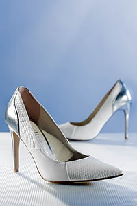 pair of silver leather pumps on white surface thumbnail