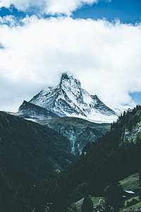 black mountain snow covered under white sky thumbnail