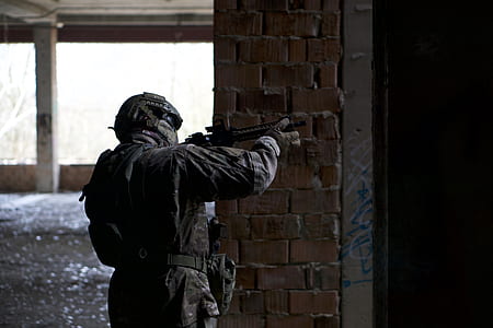 person holding rifle thumbnail