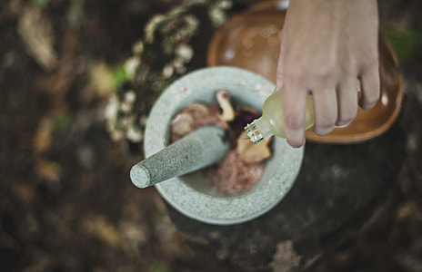 person using grey mortar and pestle thumbnail