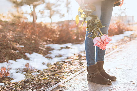 Young girl with roses on the street thumbnail