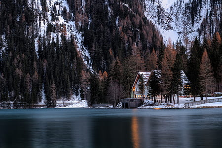 beige house beside body of water at daytime thumbnail