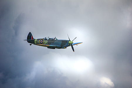 plane under cloudy sky thumbnail