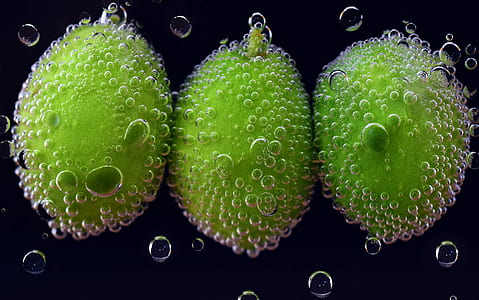 three green fruits under water thumbnail
