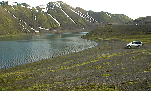 silver SUV near lake thumbnail