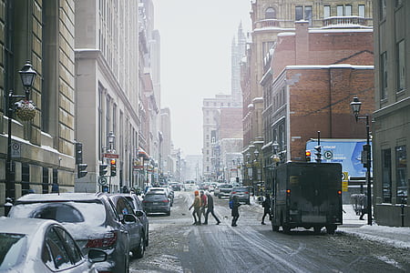 three people crossing pedestrian lane thumbnail