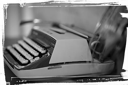 grayscale photography of typewriter thumbnail