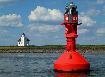 red and gray sea bouy on sea at daytime thumbnail