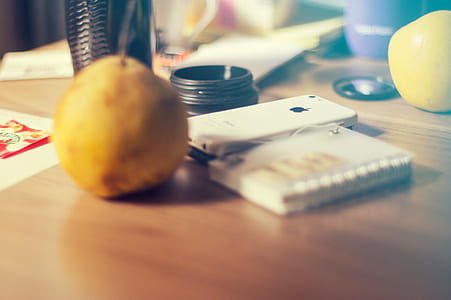 white iPhone 5C and yellow fruit thumbnail