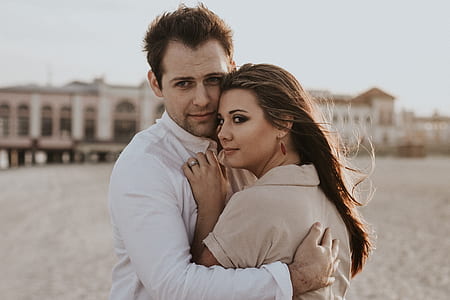 man hugging woman during daytime thumbnail