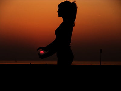 silhouette photo of woman during sunset thumbnail
