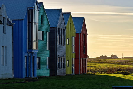 blue, green, gray, yellow, and red wooden houses thumbnail