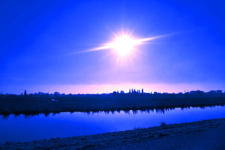 body of water during sunrise thumbnail