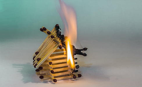 burning matchstick house photograph thumbnail