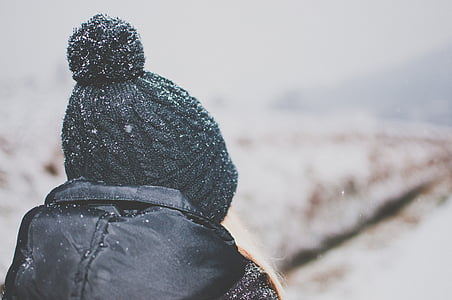 person wearing black bobble cap in selective focus photography thumbnail