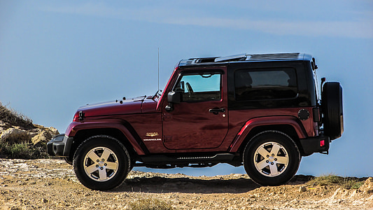 red and black SUV on cliff thumbnail