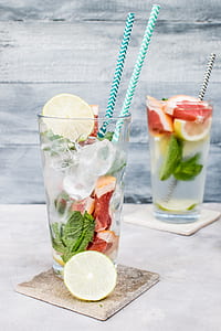 highball glass with slice lemon and tube ice thumbnail