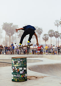 people watching a man doing skate tricks thumbnail