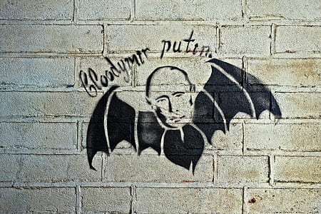 Vladimir Putin bat wall graffiti thumbnail