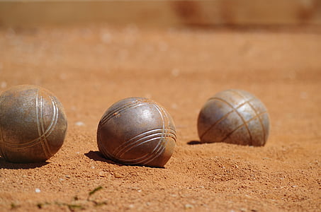 gray balls on sand thumbnail