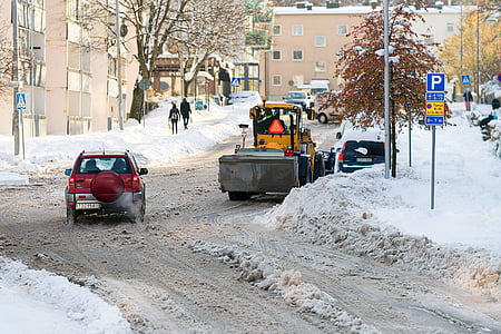 two people standing on snow-covered field near vehicles during daytime thumbnail