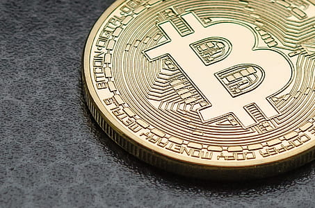 Bitcoin token on black surface thumbnail