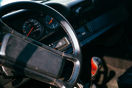 Interior of a car with speedometer, dashborad and gear lever in the background thumbnail
