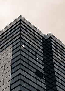 blue glass high rise building thumbnail