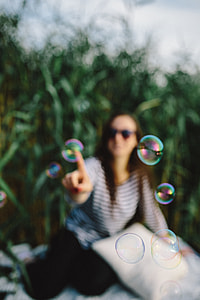 Having fun with soap bubbles in the nature thumbnail