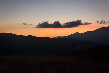 silhouette photo of mountain during sunset thumbnail