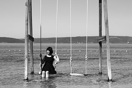 woman sitting on swing thumbnail