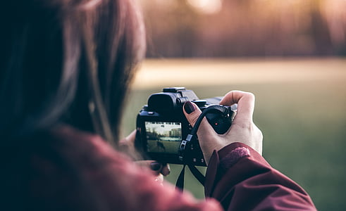 person holding camera thumbnail
