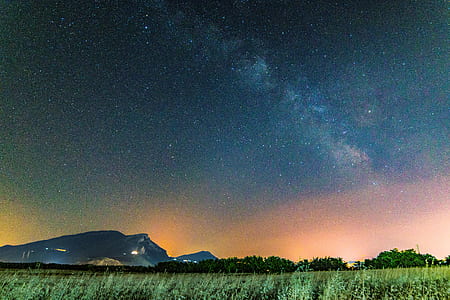 green grass field under yellow horizon thumbnail