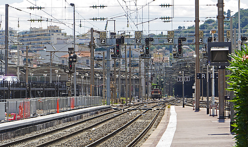 train on gray railroad tracks thumbnail