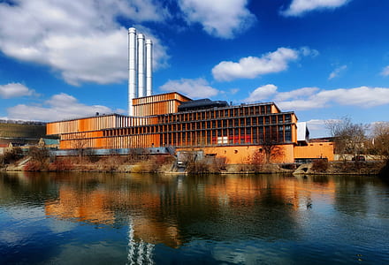orange building beside water thumbnail