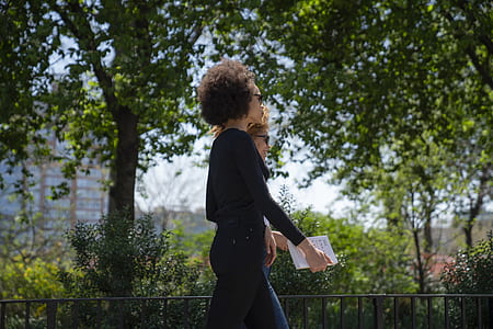 women walking near trees thumbnail