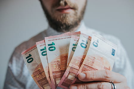 Person Holding Six 10 Banknotes thumbnail